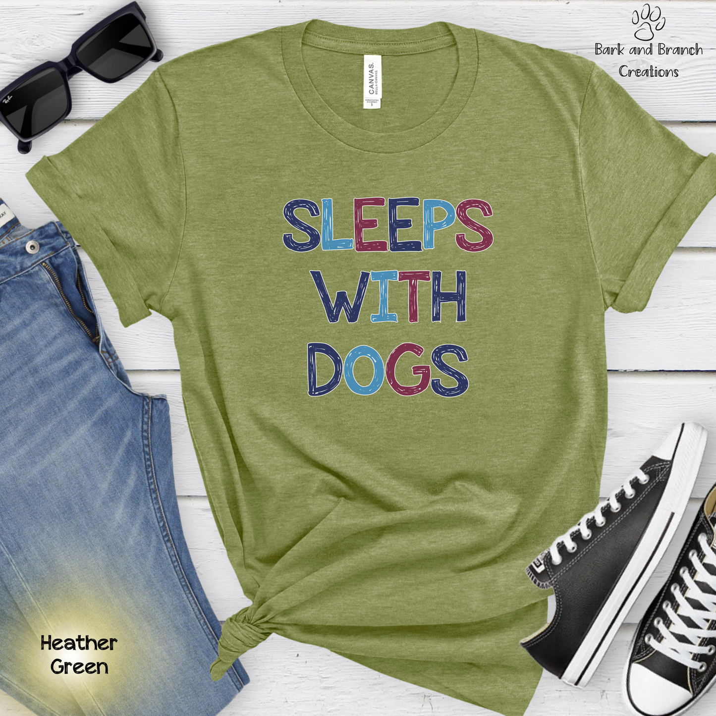 Sleeps With Dogs Soft T-Shirt | Funny Dog Mom Tee | Dog Dad Shirt | Dog Lover Gift | Support Rescue Efforts