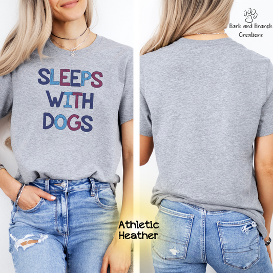 Sleeps With Dogs Soft T-Shirt | Funny Dog Mom Tee | Dog Dad Shirt | Dog Lover Gift | Support Rescue Efforts