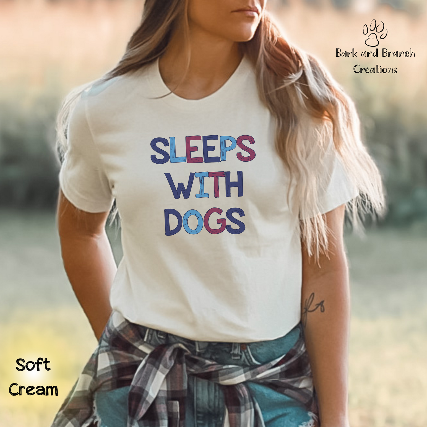 Sleeps With Dogs Soft T-Shirt | Funny Dog Mom Tee | Dog Dad Shirt | Dog Lover Gift | Support Rescue Efforts